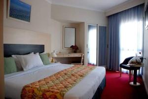 Postel nebo postele na pokoji v ubytování AraCan Pyramids Hotel By Versailles