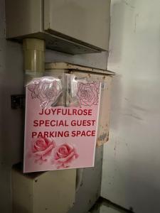 a sign is posted on the side of a refrigerator at Joyful Rose in Ginowan