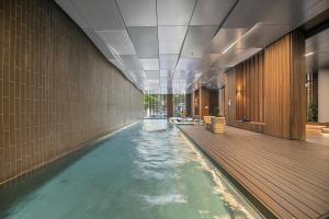 a swimming pool in a building with a swimming pool at Fabulous 1-Bed with Pool and Private Courtyard DUPLICATE in Melbourne