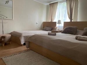 Postel nebo postele na pokoji v ubytování Privatus namelis Jūros g. 61