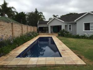 a swimming pool in the yard of a house at Larkspur Place in East London