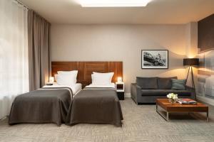 Posteľ alebo postele v izbe v ubytovaní City Park Hotel & Residence