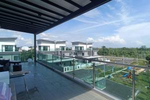 a large balcony with a view of a building at Serenity Haven in Sungai Besar