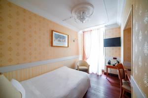 Postel nebo postele na pokoji v ubytování Phi Hotel Principe