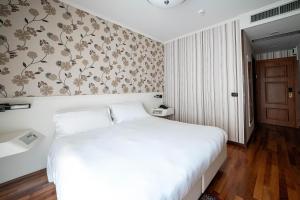 Postel nebo postele na pokoji v ubytování Phi Hotel Principe