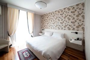 Postel nebo postele na pokoji v ubytování Phi Hotel Principe