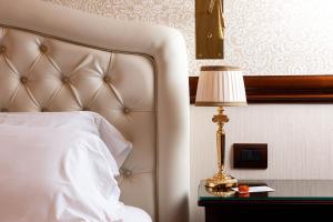 Postel nebo postele na pokoji v ubytování Phi Hotel Principe