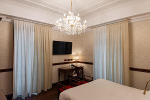 Postel nebo postele na pokoji v ubytování Phi Hotel Principe