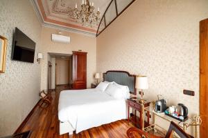 Postel nebo postele na pokoji v ubytování Phi Hotel Principe