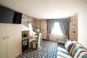 TV a/nebo společenská místnost v ubytování Phi Hotel Principe