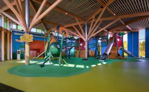 a childrens play area with a playground with slides at Center Parcs Les Landes de Gascogne in Beauziac