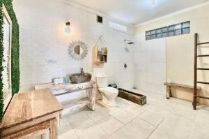 a bathroom with a sink and a toilet at Villa casa in Seminyak