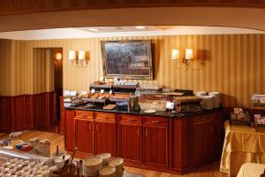 a kitchen with a counter with food on it at Phi Hotel Principe in Cuneo