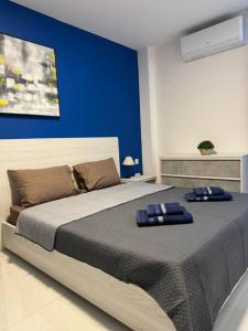 Llit o llits en una habitació de Amadeo Suites