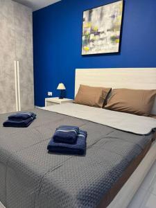 Postel nebo postele na pokoji v ubytování Amadeo Suites