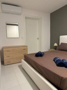 Llit o llits en una habitació de Amadeo Suites