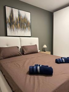 Llit o llits en una habitació de Amadeo Suites