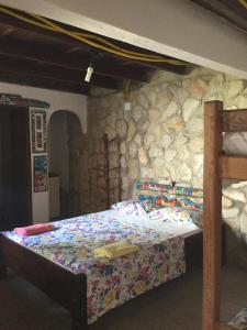 Katil atau katil-katil dalam bilik di Pousada Alquimia