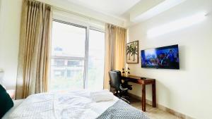TV a/nebo společenská místnost v ubytování Olive Serviced Apartments - New Friends Colony