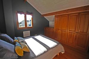 a bedroom with a bed and a window at Les tilleuls in Glanges