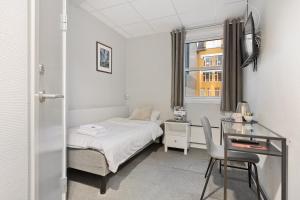 Voodi või voodid majutusasutuse Enter Skansen Hotel toas