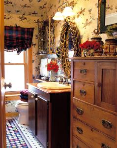 a bathroom with a sink and a toilet at Goldilocks Cabin in Stowe