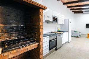 A kitchen or kitchenette at Villa Dolphin by Slow Villas