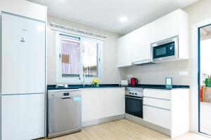 A kitchen or kitchenette at Villa Dolphin by Slow Villas