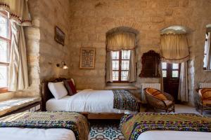 Postel nebo postele na pokoji v ubytování Jerusalem Hotel