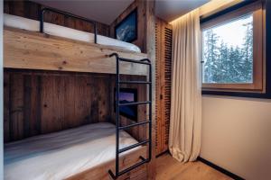 Ένα ή περισσότερα κρεβάτια σε δωμάτιο στο Antarès ORION 102 - Ski inski out apartment