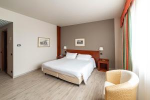Phi Hotel Cavalieri客房内的一张或多张床位