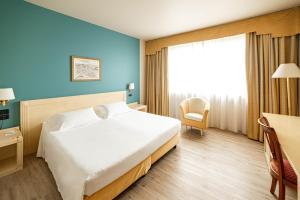 Phi Hotel Cavalieri客房内的一张或多张床位