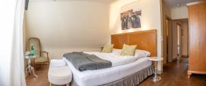Postel nebo postele na pokoji v ubytování Friedrich von Schiller Hotel
