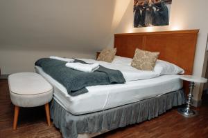Postel nebo postele na pokoji v ubytování Friedrich von Schiller Hotel