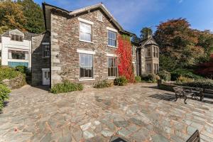 a stone patio in front of a house at Langdale Crag in Grasmere
