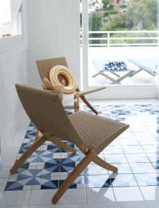 a chair sitting on a tiled floor in a room at Casa Dalù in Positano