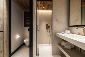 a bathroom with a sink and a toilet at Antarès SIRIUS 302 - Ski inski out family apartment in Méribel +5 photos