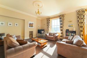 a living room with two couches and a coffee table at Langdale Crag in Grasmere