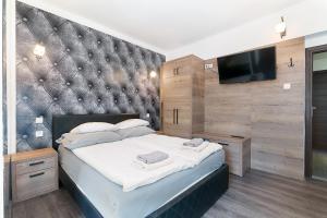 Ein Bett oder Betten in einem Zimmer der Unterkunft Villa Platinum