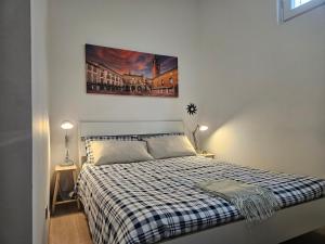 Postel nebo postele na pokoji v ubytování CIAO BELLI flat city centre and parking - Appartamento centrale con posto auto