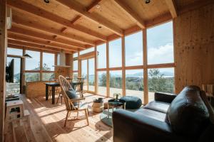 a living room with a couch and a table at Kanran in Mitoyo