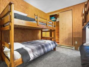 a bedroom with two bunk beds and a closet at Leatherbark 103A 3BR 2BA Quiet And Serene Private Deck WiFi in Snowshoe