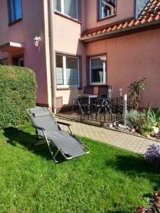 a lawn chair in the yard of a house at Sommerflieder in Güntersberge