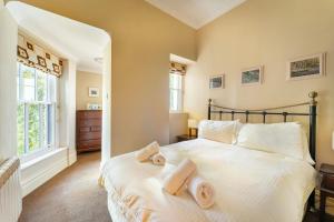 a bedroom with a large bed with towels on it at Langdale Crag in Grasmere