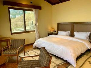 Postel nebo postele na pokoji v ubytování Mountain Lodges of Nepal - Dhampus