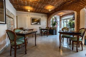 a dining room with wooden tables and chairs at Agriturismo San Martino in Clavesana
