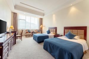 Postel nebo postele na pokoji v ubytování HeBei Cuipingshan Guest House