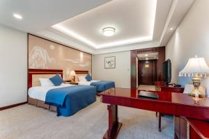 Postel nebo postele na pokoji v ubytování HeBei Cuipingshan Guest House