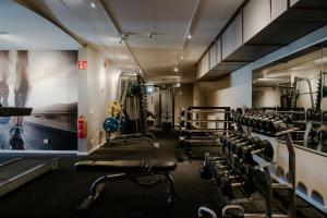 a gym with lots of equipment in a room at Haga Slott in Enköping