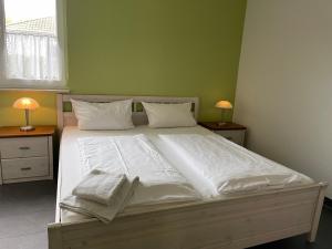 Postel nebo postele na pokoji v ubytování Ferienhaus, Am Süßling 15, Glowe